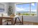 Bright home office with stylish desk and expansive windows showcasing mountain views at 974 N Faver Dr, Castle Rock, CO 80109