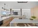 Bright kitchen with a waterfall island, breakfast bar, and seamless flow to dining area at 974 N Faver Dr, Castle Rock, CO 80109