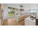 Modern kitchen with large windows, white countertops, and stylish wood cabinetry at 974 N Faver Dr, Castle Rock, CO 80109