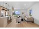 Open-concept living room with kitchen island, sleek lighting, and scenic views at 974 N Faver Dr, Castle Rock, CO 80109