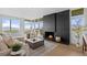 Stylish living room boasts a sleek fireplace, large windows, and elegant furnishings at 974 N Faver Dr, Castle Rock, CO 80109