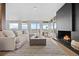 Elegant living room filled with natural light, featuring a cozy fireplace and scenic views at 974 N Faver Dr, Castle Rock, CO 80109