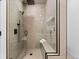 Modern shower featuring a glass enclosure, dual showerheads, and a convenient built-in bench at 974 N Faver Dr, Castle Rock, CO 80109