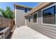 Private backyard featuring a concrete patio, wood fence, and exterior home details with ample outdoor space at 3346 N Josephine St, Denver, CO 80205