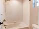 Bright white bathroom featuring a tub and shower combination with a hand held shower fixture at 3346 N Josephine St, Denver, CO 80205