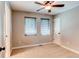 Well-lit bedroom with two windows, carpet flooring, and a ceiling fan for optimal comfort and ventilation at 3346 N Josephine St, Denver, CO 80205