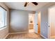 Bedroom showcasing neutral walls, a window with blinds, carpet flooring, and view to ensuite bath at 3346 N Josephine St, Denver, CO 80205