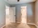 Spacious bedroom featuring neutral colors, carpet flooring, and an adjoining bathroom for added convenience at 3346 N Josephine St, Denver, CO 80205