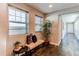 Inviting entryway with a bench seat and a decorative plant by two large windows at 3346 N Josephine St, Denver, CO 80205
