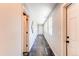 Bright hallway with modern flooring and recessed lighting leads to various rooms at 3346 N Josephine St, Denver, CO 80205