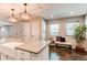 Bright kitchen with stainless steel appliances, pendant lights, and stylish quartz countertops at 3346 N Josephine St, Denver, CO 80205