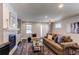 Bright living room features a cozy fireplace, neutral walls, and large windows for natural light at 3346 N Josephine St, Denver, CO 80205