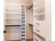 Walk-in closet with custom shelving and drawers provides ample storage space in this light-filled room at 3346 N Josephine St, Denver, CO 80205