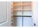 Walk-in closet with custom shelving and drawers provides ample storage space, with carpeting at 3346 N Josephine St, Denver, CO 80205