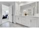 Gorgeous bathroom with double vanity, modern cabinetry, and access to the main bedroom at 17809 Fox St, Broomfield, CO 80023