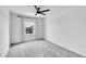 Minimalist bedroom with neutral walls, a window, and plush carpeting at 17809 Fox St, Broomfield, CO 80023