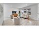 Bright and airy living room with modern furnishings and plenty of natural light from large windows at 17809 Fox St, Broomfield, CO 80023