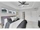 Well-lit main bedroom features tray ceilings, plush carpet, and modern decorations at 17809 Fox St, Broomfield, CO 80023