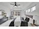 Stunning main bedroom boasts tray ceiling, a large window, and sophisticated decor at 17809 Fox St, Broomfield, CO 80023