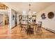 Dining area with table and chairs connects to the kitchen and laundry room at 10450 Hondah Dr, Littleton, CO 80127