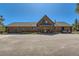 Charming log home featuring a large two-car garage and spacious paved driveway at 10450 Hondah Dr, Littleton, CO 80127