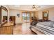 Spacious main bedroom with wood floors, deck access, and scenic views at 10450 Hondah Dr, Littleton, CO 80127