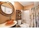 Bathroom featuring a decorative bowl sink and a shower-tub combination at 9875 Greensview Cir, Lone Tree, CO 80124
