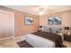 Comfortable bedroom features neutral walls, carpet flooring, and art at 9875 Greensview Cir, Lone Tree, CO 80124
