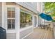 Outdoor deck area featuring a table with chairs, an awning, and scenic views at 9875 Greensview Cir, Lone Tree, CO 80124