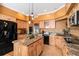 Kitchen features custom cabinets, an island, and modern appliances at 9875 Greensview Cir, Lone Tree, CO 80124