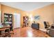 Inviting home office with built-in shelving and wood flooring at 9875 Greensview Cir, Lone Tree, CO 80124