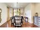 Dining room with hardwood floors, large windows and chandelier at 4134 Heatherhill Cir, Longmont, CO 80503