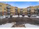 Exterior view of a low rise condo complex with parking in front at 9019 E Panorama Cir # D502, Englewood, CO 80112