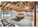 Unfinished basement with a pool table, egress window and a walk-out to the backyard at 527 Stonemont Dr, Castle Pines, CO 80108