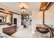 Bathroom features granite counters, bronze vessel sinks, a glass shower, and a walk-in closet at 527 Stonemont Dr, Castle Pines, CO 80108