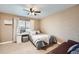 Well-lit bedroom with modern furniture, decorative wall design, large window and gray accents at 527 Stonemont Dr, Castle Pines, CO 80108