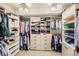 Walk-in closet featuring ample shelving, hanging space, and built-in drawers at 527 Stonemont Dr, Castle Pines, CO 80108