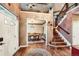 Elegant foyer featuring hardwood floors, a staircase, and a view into the formal dining room, offering a grand entrance at 527 Stonemont Dr, Castle Pines, CO 80108
