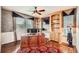 Bright office featuring built-in shelving, a ceiling fan, and natural light at 527 Stonemont Dr, Castle Pines, CO 80108