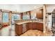 Open-concept kitchen with stainless steel appliances and hardwood floors at 527 Stonemont Dr, Castle Pines, CO 80108