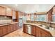 Well-equipped kitchen with stainless appliances and views of the breakfast area at 527 Stonemont Dr, Castle Pines, CO 80108