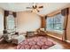 Sitting room with large windows, hardwood flooring, and comfortable seating at 527 Stonemont Dr, Castle Pines, CO 80108