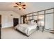 Spacious main bedroom with large bed, high ceilings and modern ceiling fan at 527 Stonemont Dr, Castle Pines, CO 80108