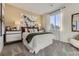 Comfortable bedroom featuring a statement headboard, natural light, and bedside tables at 13960 Hanging Lake St, Parker, CO 80138