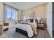 Cozy bedroom with neutral decor, vanity, large window, and plush carpeting at 13960 Hanging Lake St, Parker, CO 80138