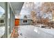 Snowy backyard with storage shed and stone accents at 2590 S Meade St, Denver, CO 80219