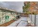 Side yard with garden beds and snow at 2590 S Meade St, Denver, CO 80219