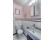 Small bathroom with pink walls and white tile at 2590 S Meade St, Denver, CO 80219