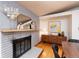 Modern fireplace with gray brick surround and wood mantel at 2590 S Meade St, Denver, CO 80219