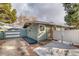 House exterior with attached garage and fenced yard at 2590 S Meade St, Denver, CO 80219